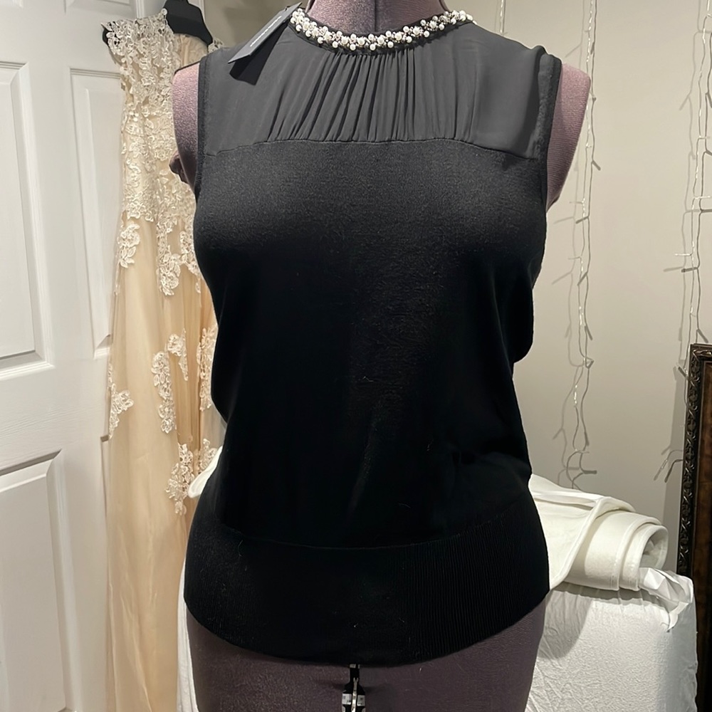 Elegant black sleeveless blouse